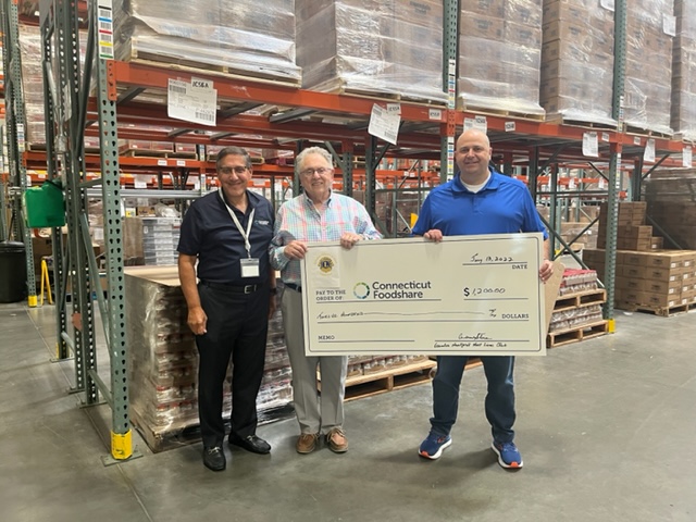 Greater Hartford Host Lions Club presents a check to Connecticut Foodshare 